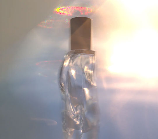 A dreamy photo of a Altra bottle with glowing mystical light in the background