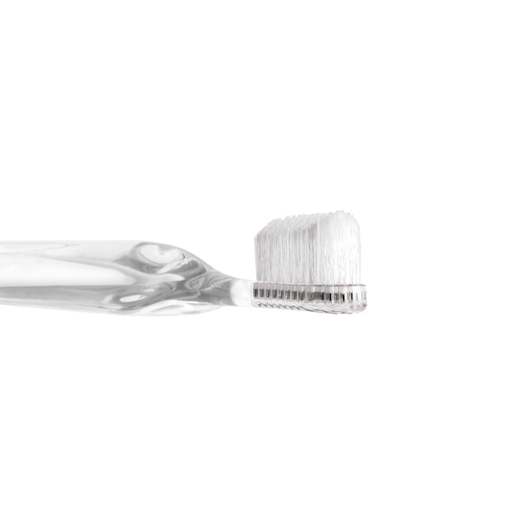 Clear Supersmile toothbrush with 45 degree bristle head on a white background