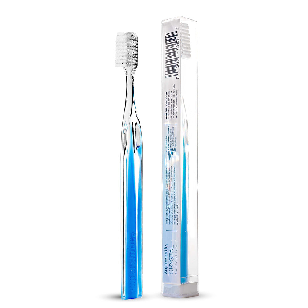 Supersmile toothbrush with blue accents next to its packaging on a white background 