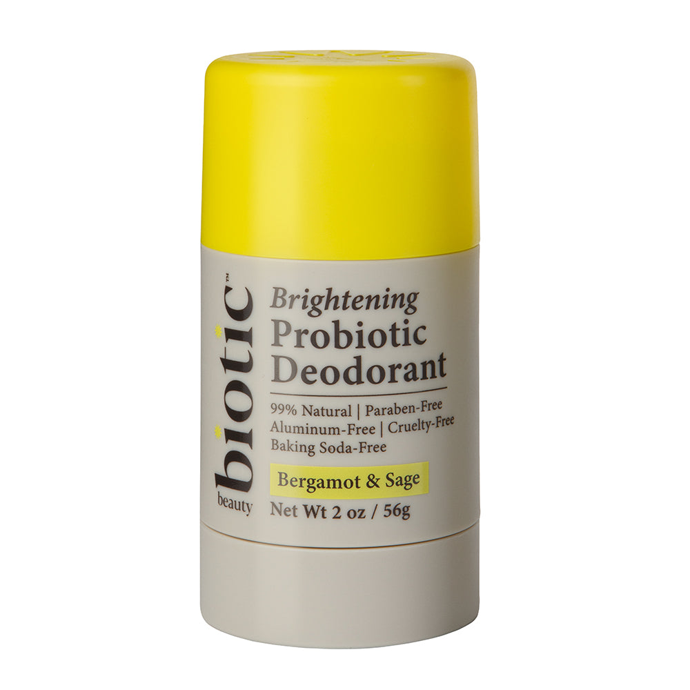 A stick deodorant labeled 'Brightening Probiotic Deodorant' with yellow and grey packaging, indicating it is 99% natural, paraben-free, and baking soda-free with a net weight of 2 oz / 56g.