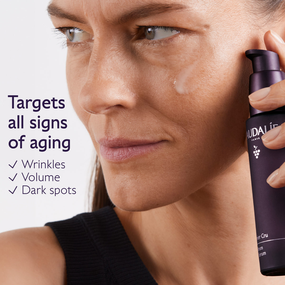 Woman applying skincare product to her face with text highlighting product benefits.