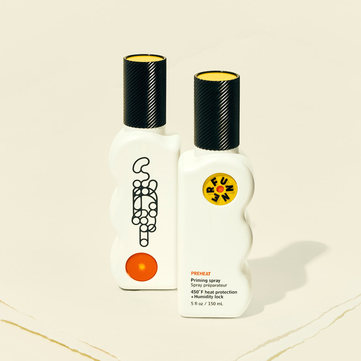 Two white bottles with black and yellow caps on a beige background
