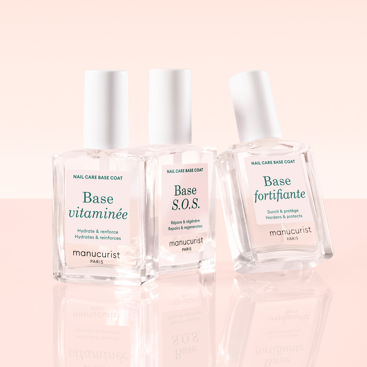 Manucurist SOS Base, Base Fortifying, and Vitamin Base on pink background 