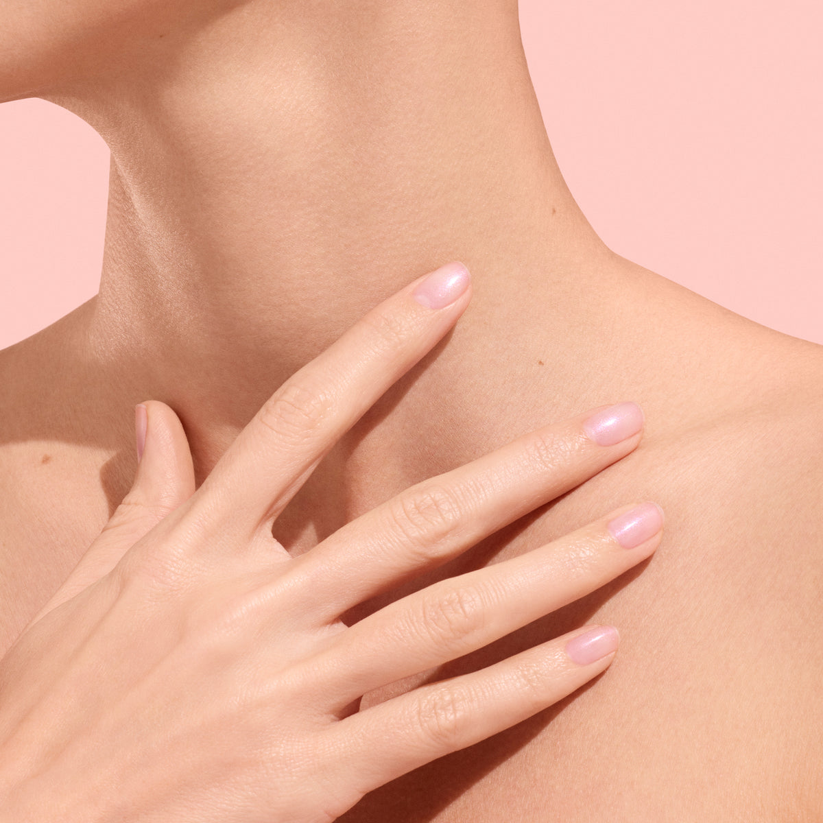 Light Shade hand on neck wearing Manucurist Active Plump 