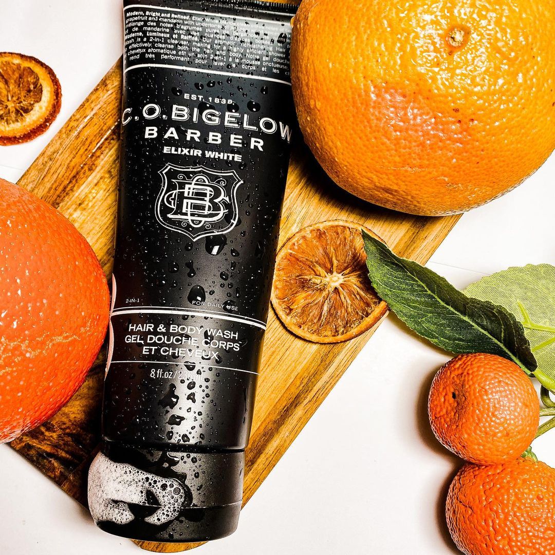 Bigelow Barber 1607 Elixir White Hair & Body Wash alongside citrus fruit 
