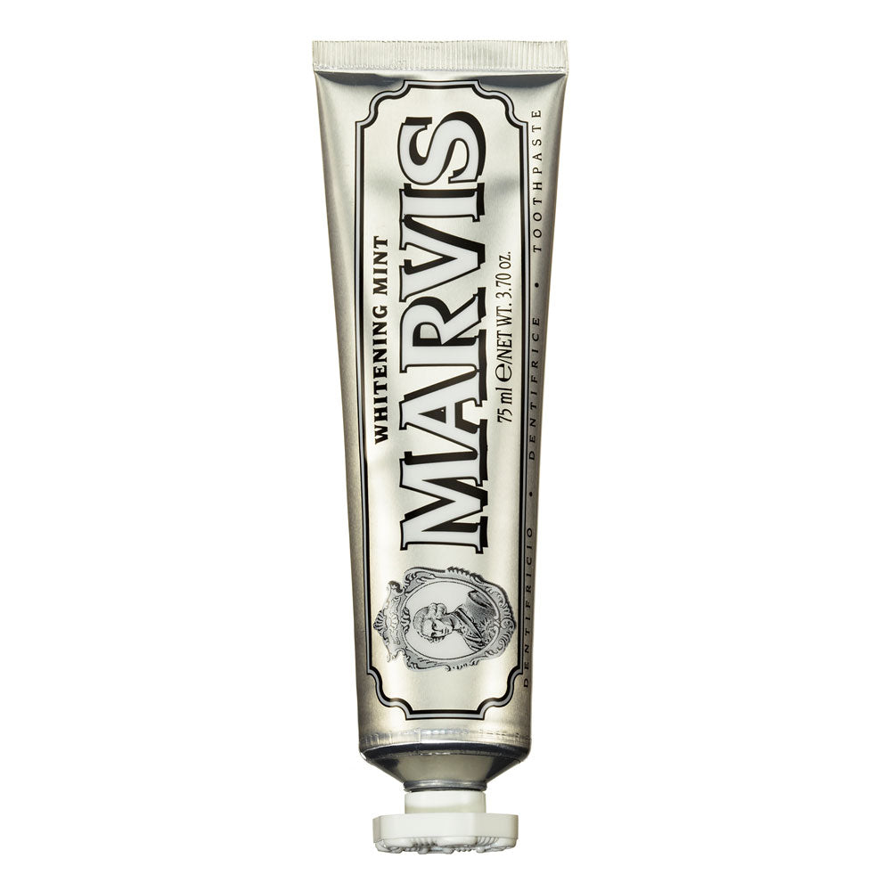 A tube of Marvis Whitening Mint Toothpaste with a silver label and distinctive branding.