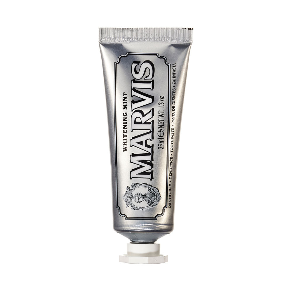 A tube of Marvis Whitening Mint Toothpaste with a silver label and distinctive branding.