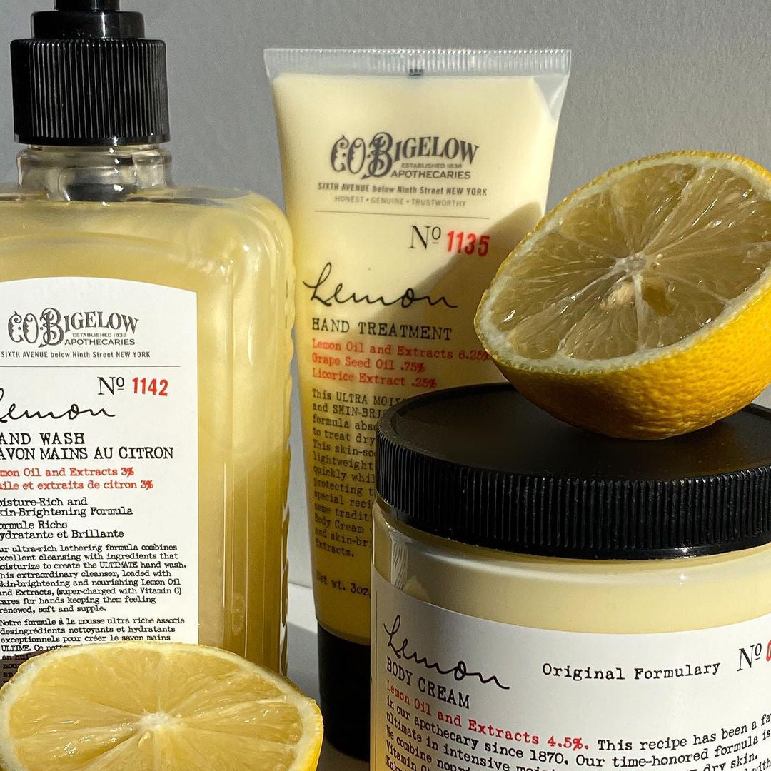 Bigelow Lemon skincare products including hand wash, hand cream, and hand  cream with lemons on a light background.