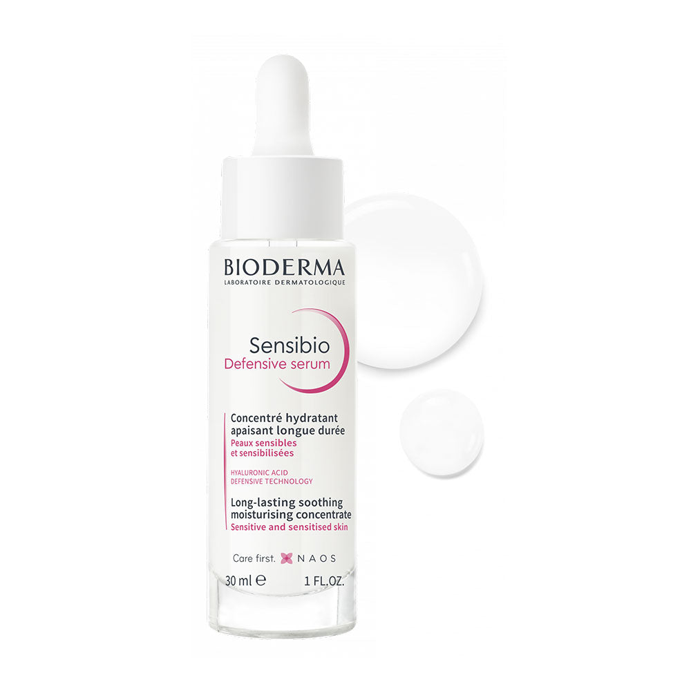 A bottle of BIODERMA Sensibio Defensive Serum with a white label and pink accents.
