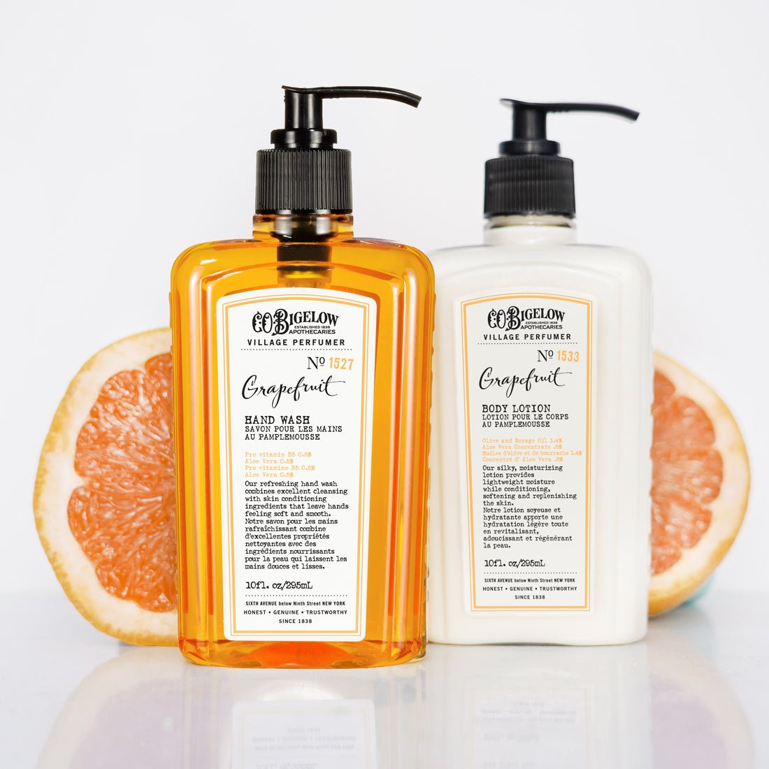 Two bottles of C.O. Bigelow Grapefruit Hand Care  products with a white background and grapefruit slices