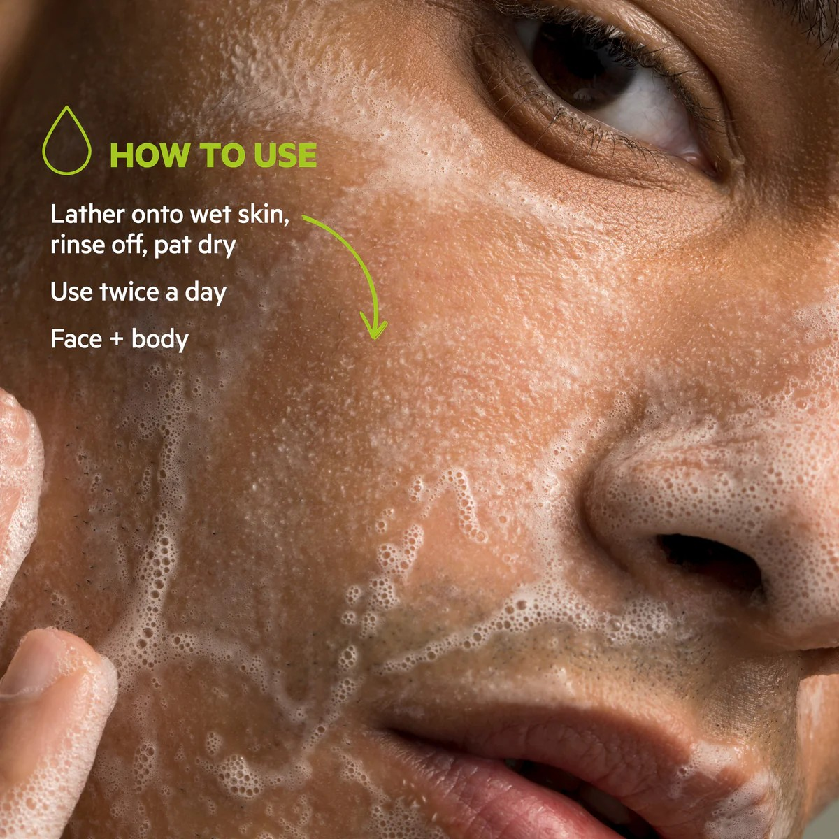 Close-up of a person applying a foamy product to their face with usage instructions.