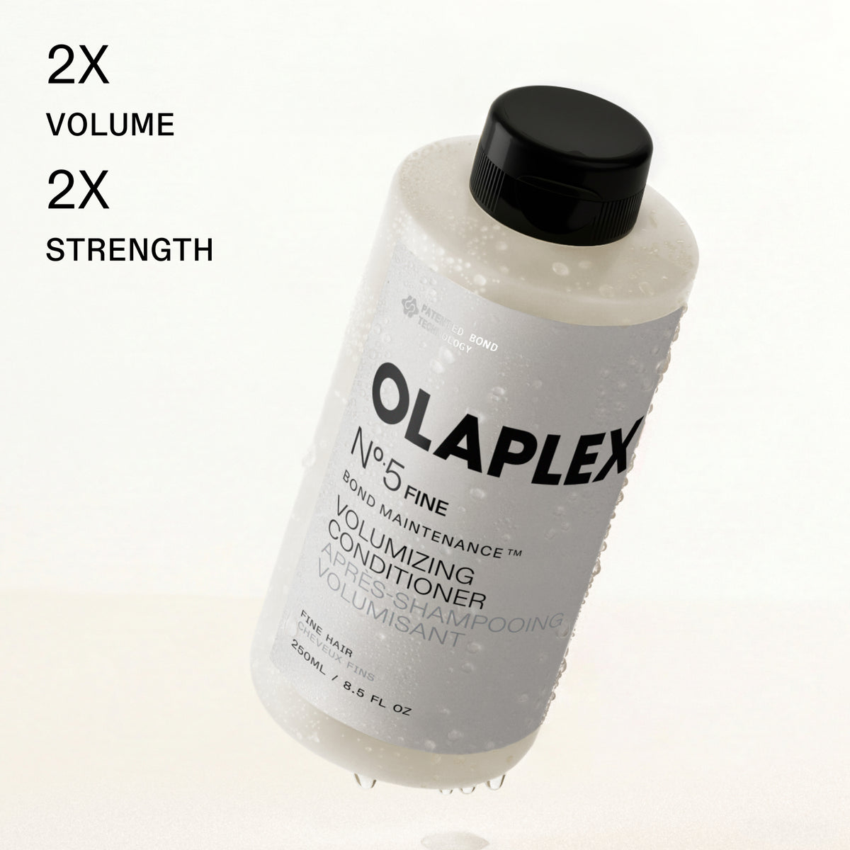 A bottle of Olaplex No.5 Fine Volumizing Conditioner with a black cap, shown on a white background with text reading '2X VOLUME 2X STRENGTH'.