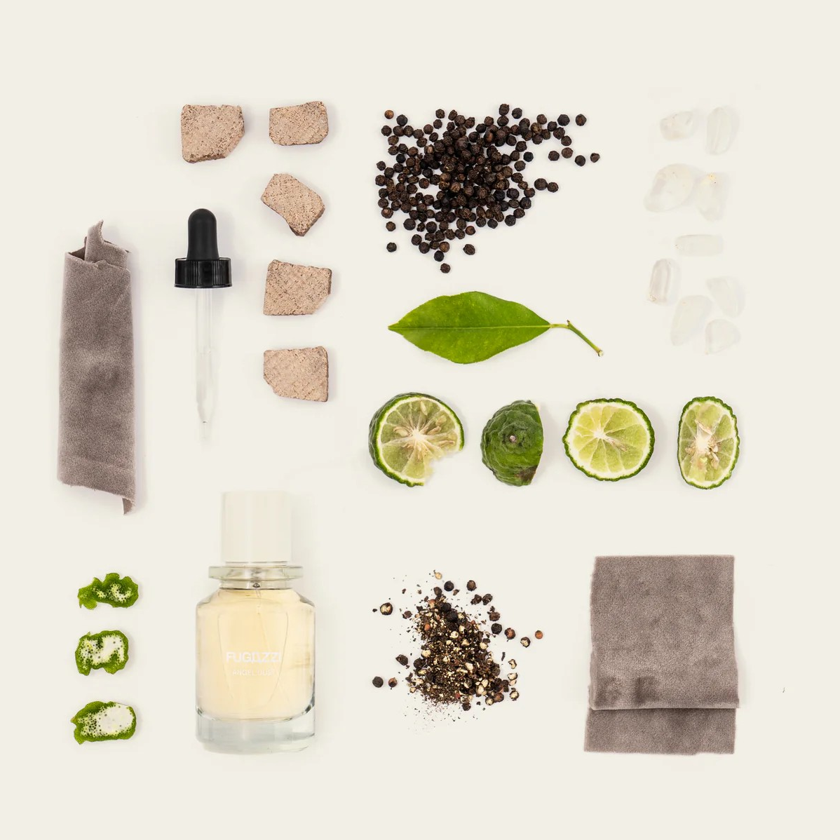 Fugazzi Scented Dry Shampoo pictured with herbs, lime wedges and spices.