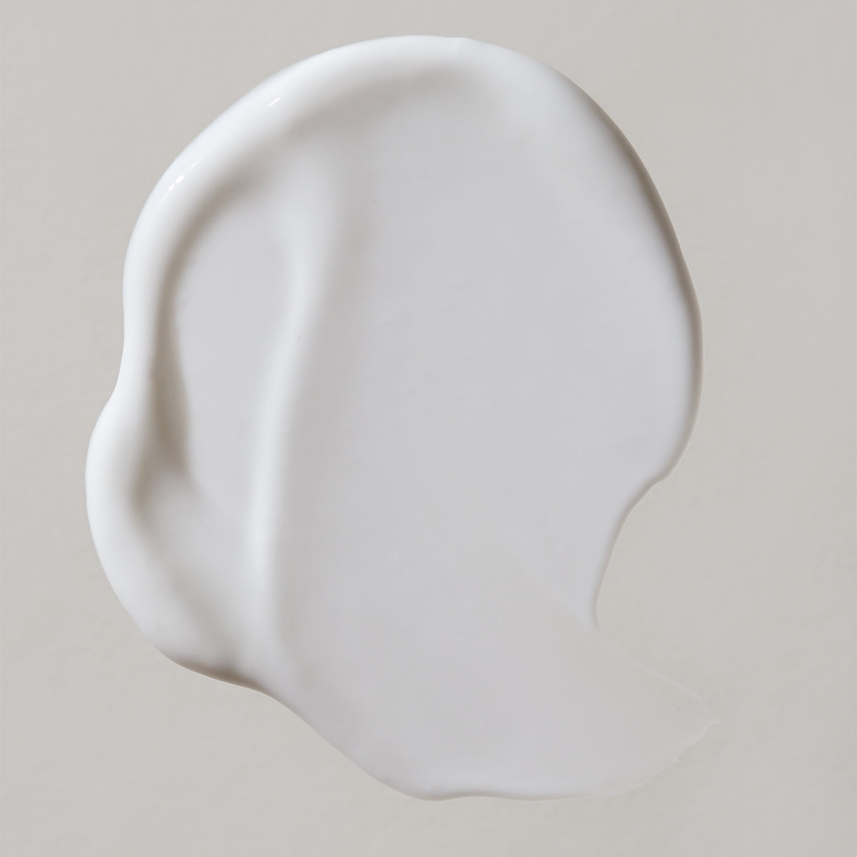 White product swatch on a beige background