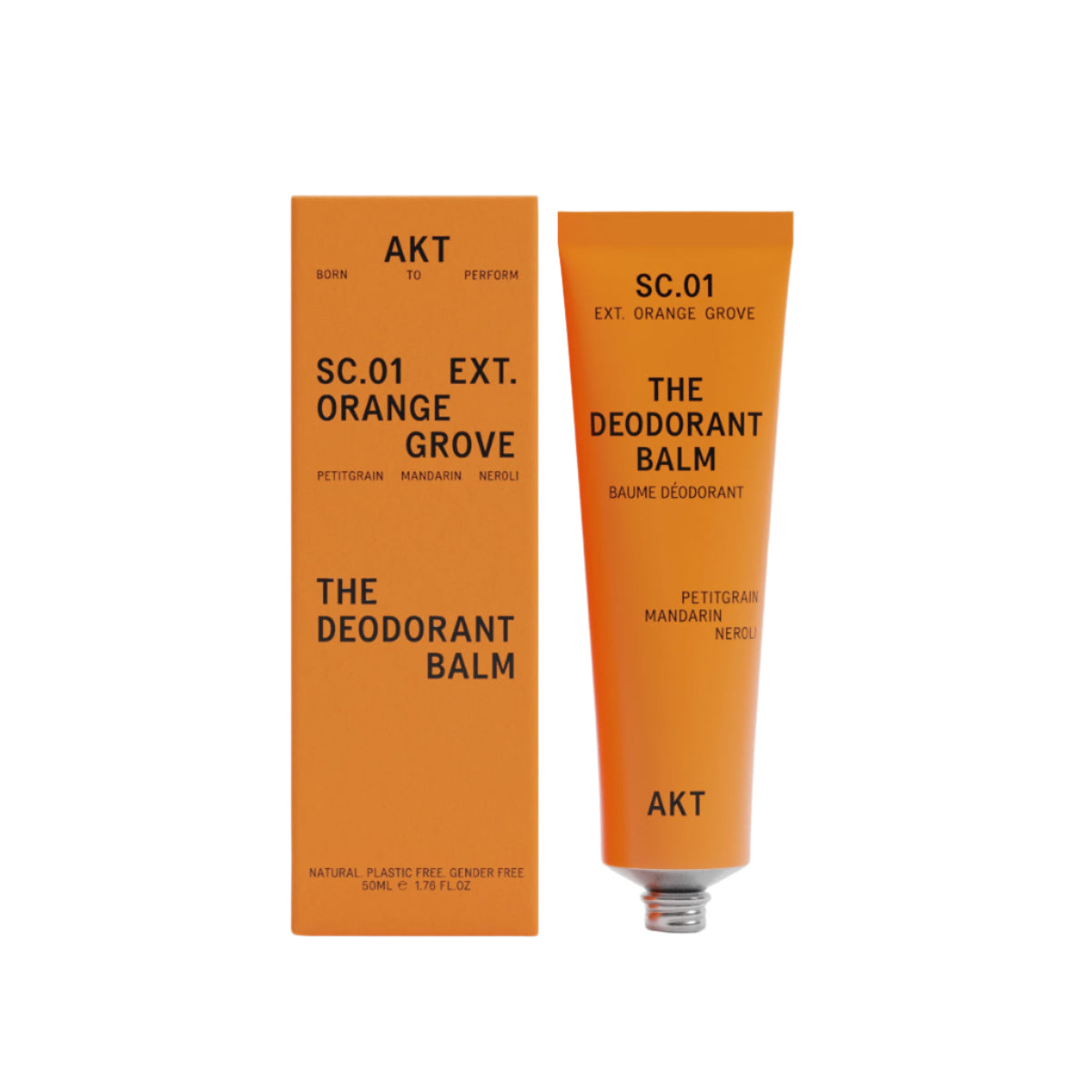 AKT Orange Grove Deodorant Balm in Orange tube next to Orange product box on a white background. 