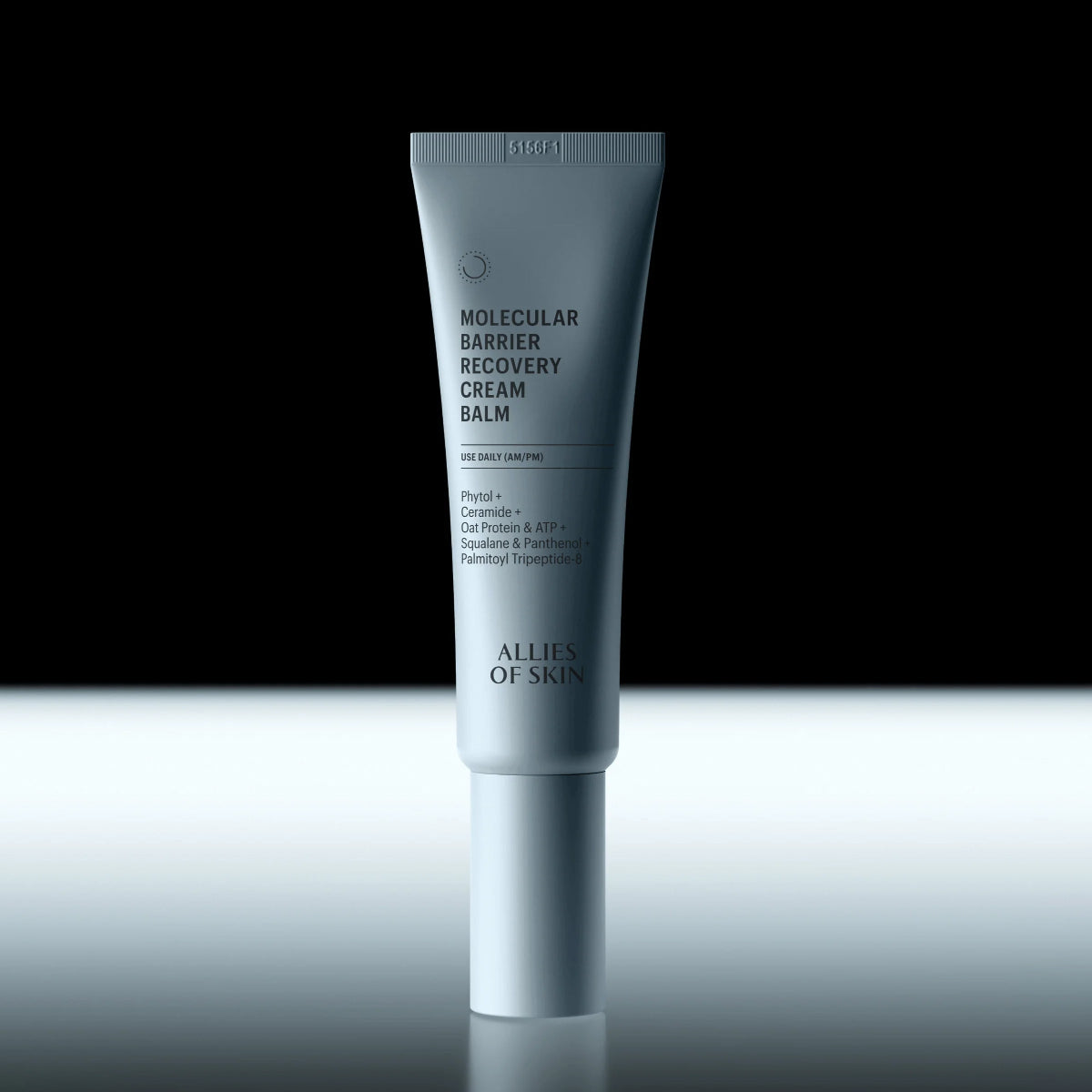 Tube of 'Molecular Barrier Recovery Cream Balm' by Allies of Skin on a reflective surface with black background