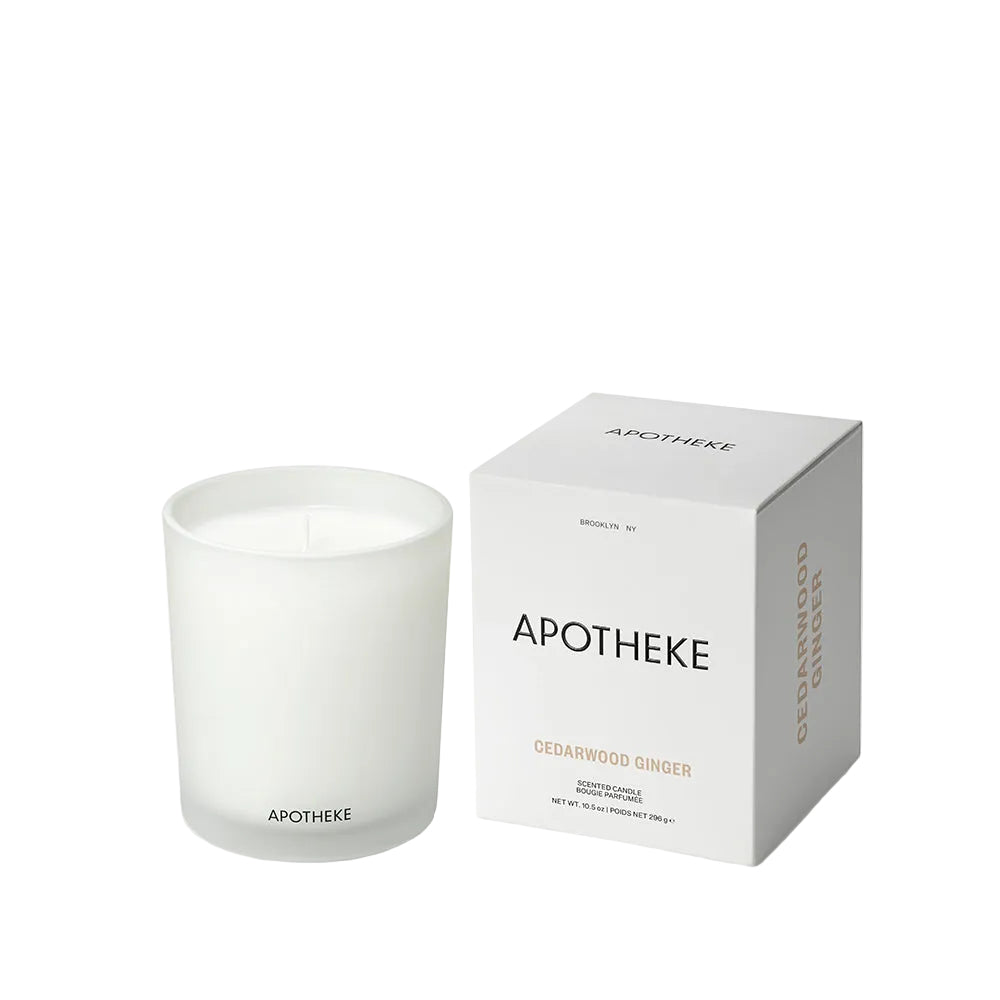 Apotheke Cedarwood Ginger candle and its packaging on a white background