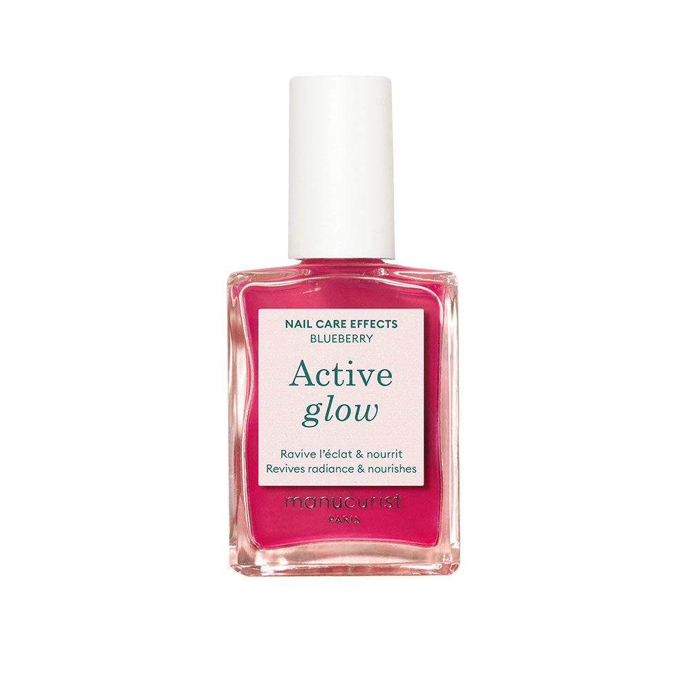 Bottle of The Manucurist's Active Glow Blueberry in front of white background.