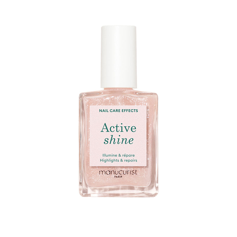 Bottle of The Manucurist's Active Shine in front of white background.