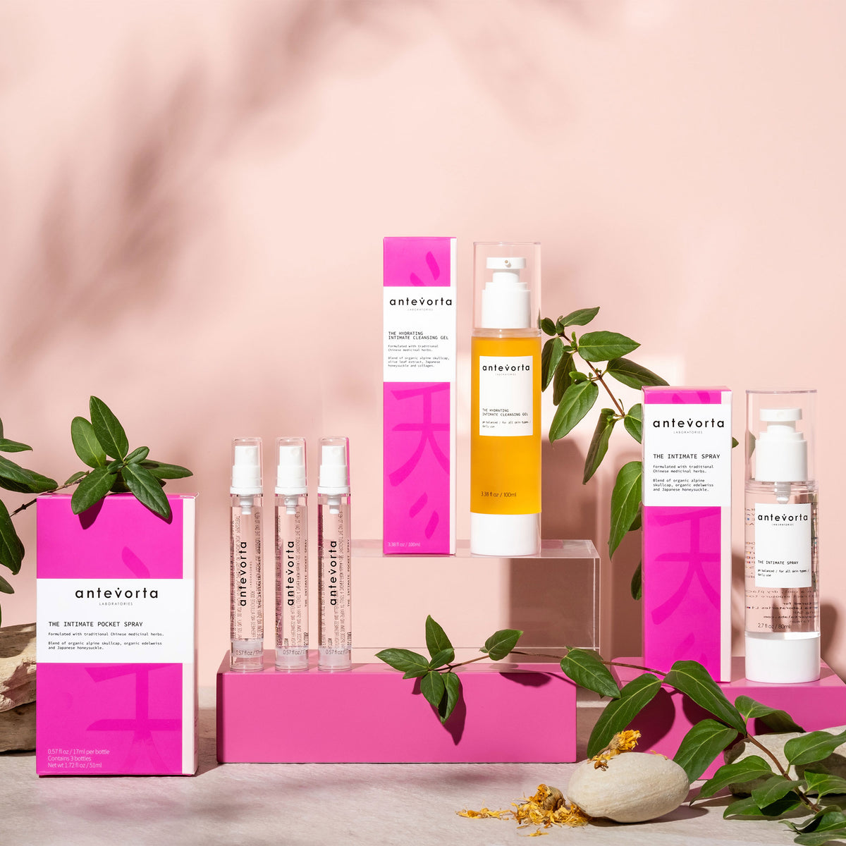 Various antevorta products on a textured surface in front of a light pink background