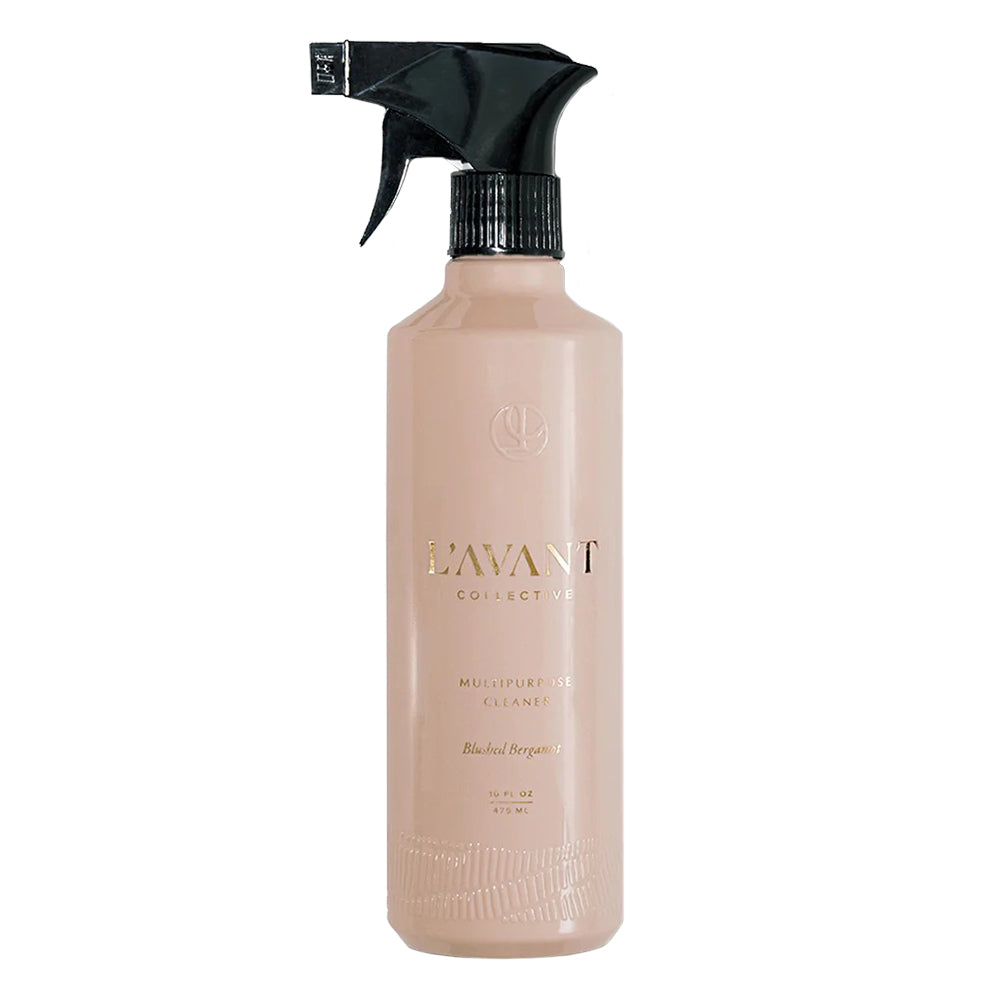 Beige spray bottle with black nozzle on a white background