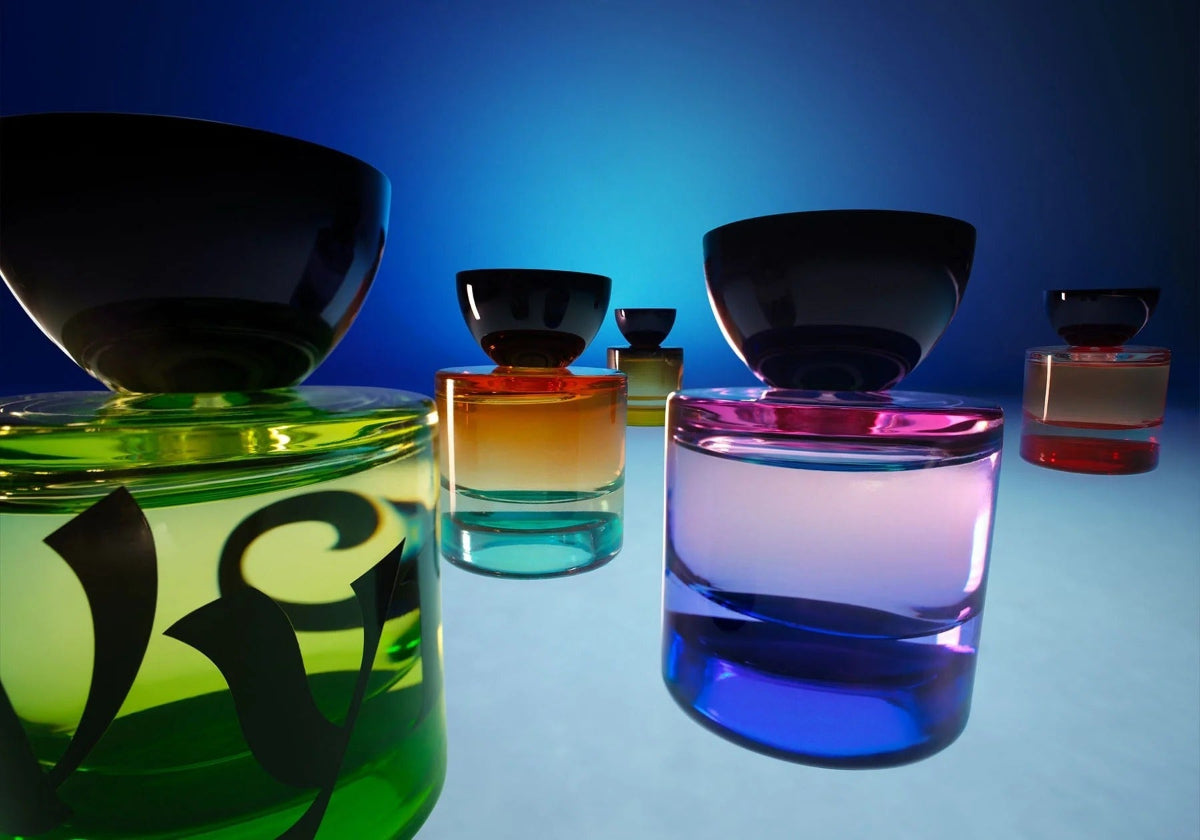 Colorful glass containers on a reflective surface with a blue gradient background