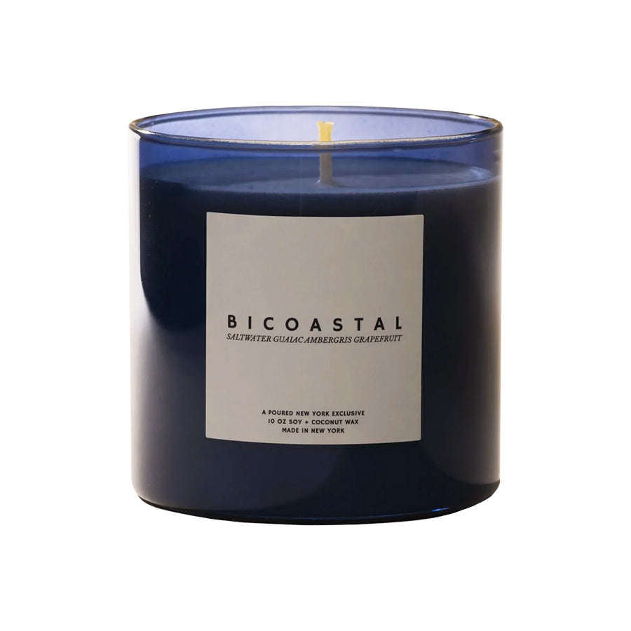 Blue candle with a label on a white background