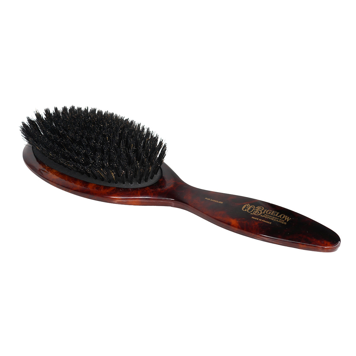 C.O. Bigelow hairbrush with black bristles on a white background