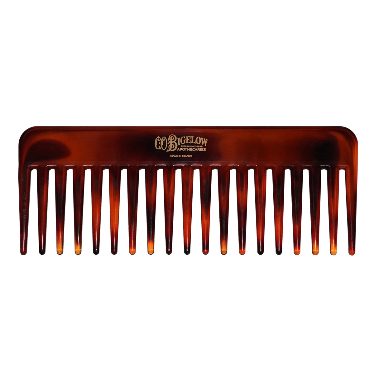 Tortoiseshell comb with 'C.O. Bigelow' branding on a white background