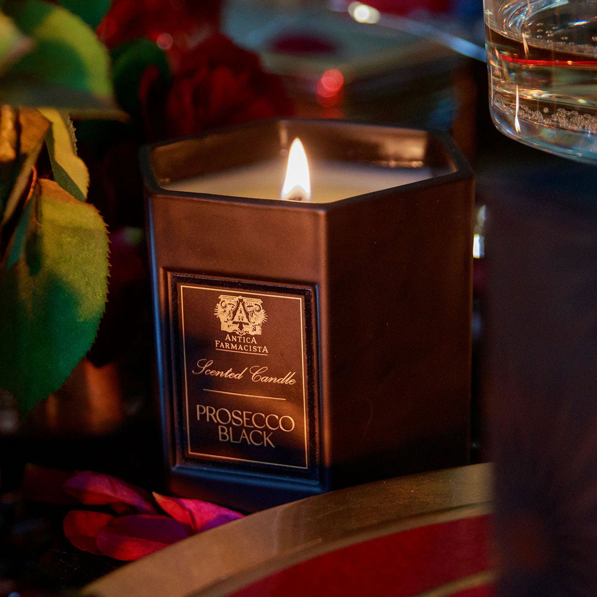 Candle surrounded by various unclear objects