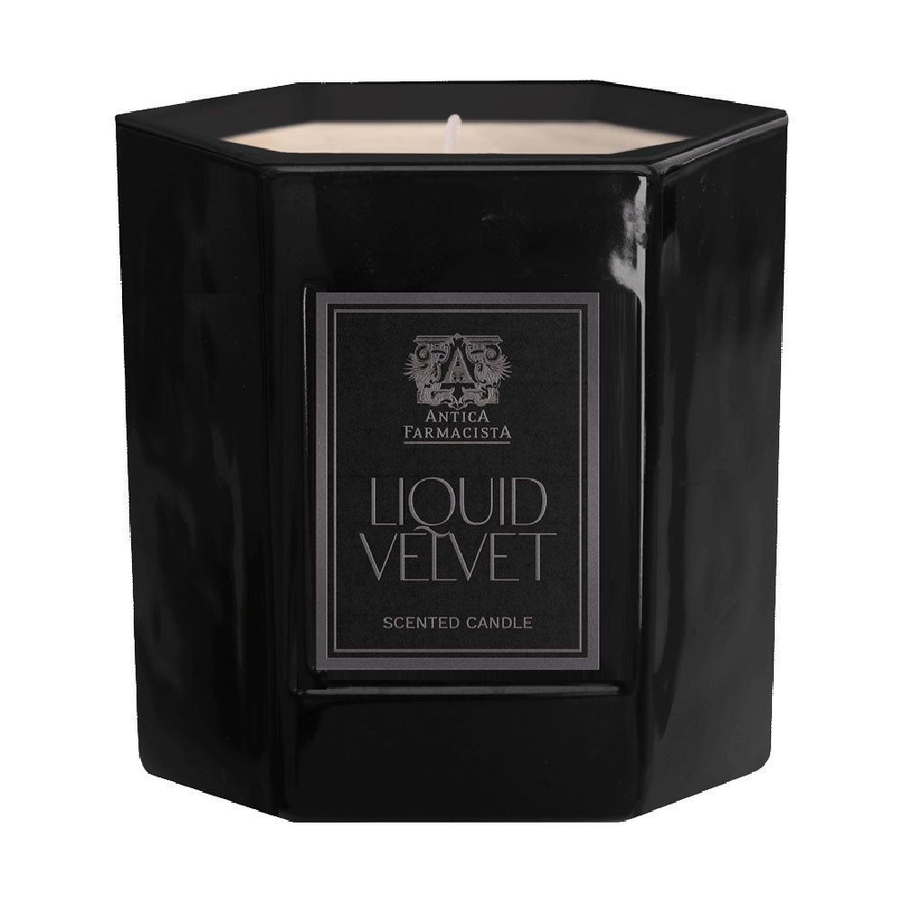 A black candle with a label reading 'LIQUID VELVET SENSED CANDLE' from Antica Farmacista.