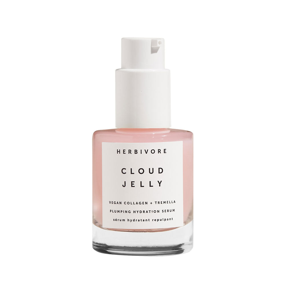 A clear glass bottle with a pump dispenser containing a light pink jelly-like serum. The label reads 'HERBIVORE CLOUD JELLY'.