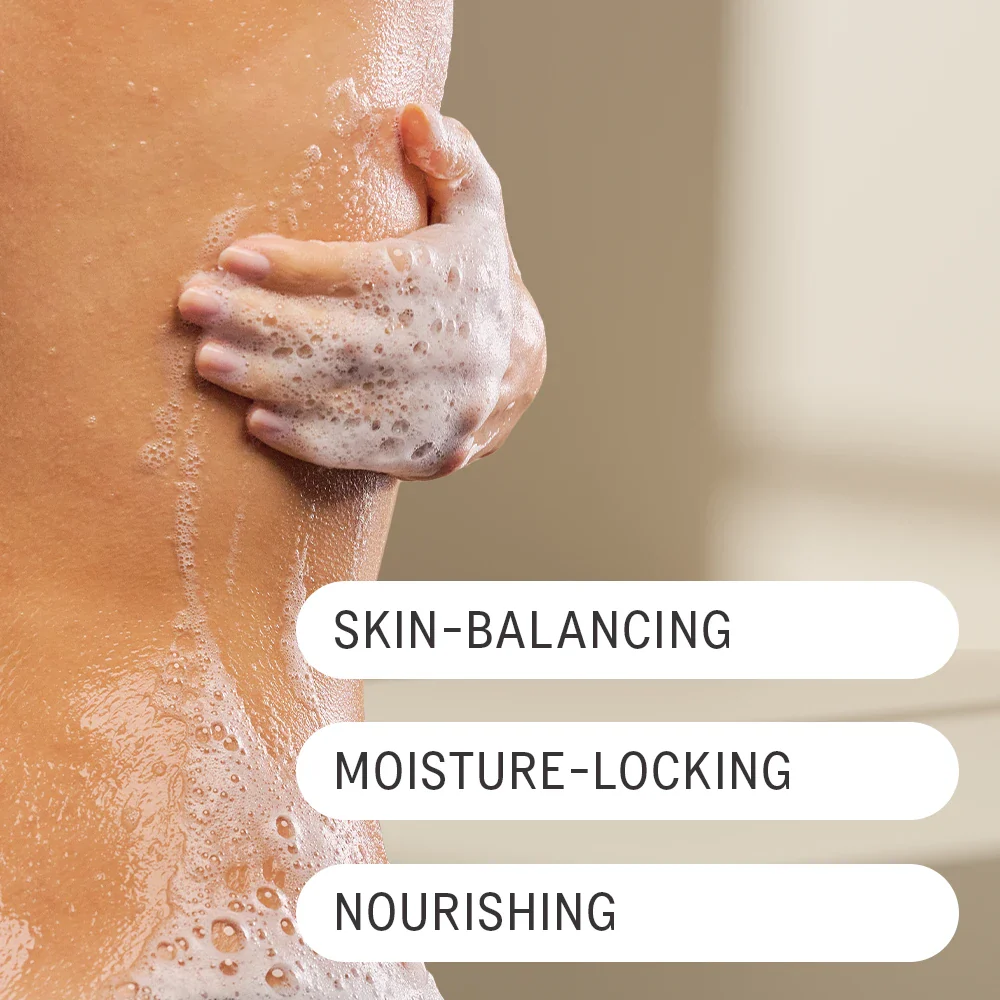 Woman using hand to lather on sudsy body wash. Text over laid on image reads "Skin-Balancing, Moisture-Locking, and Nourishing."