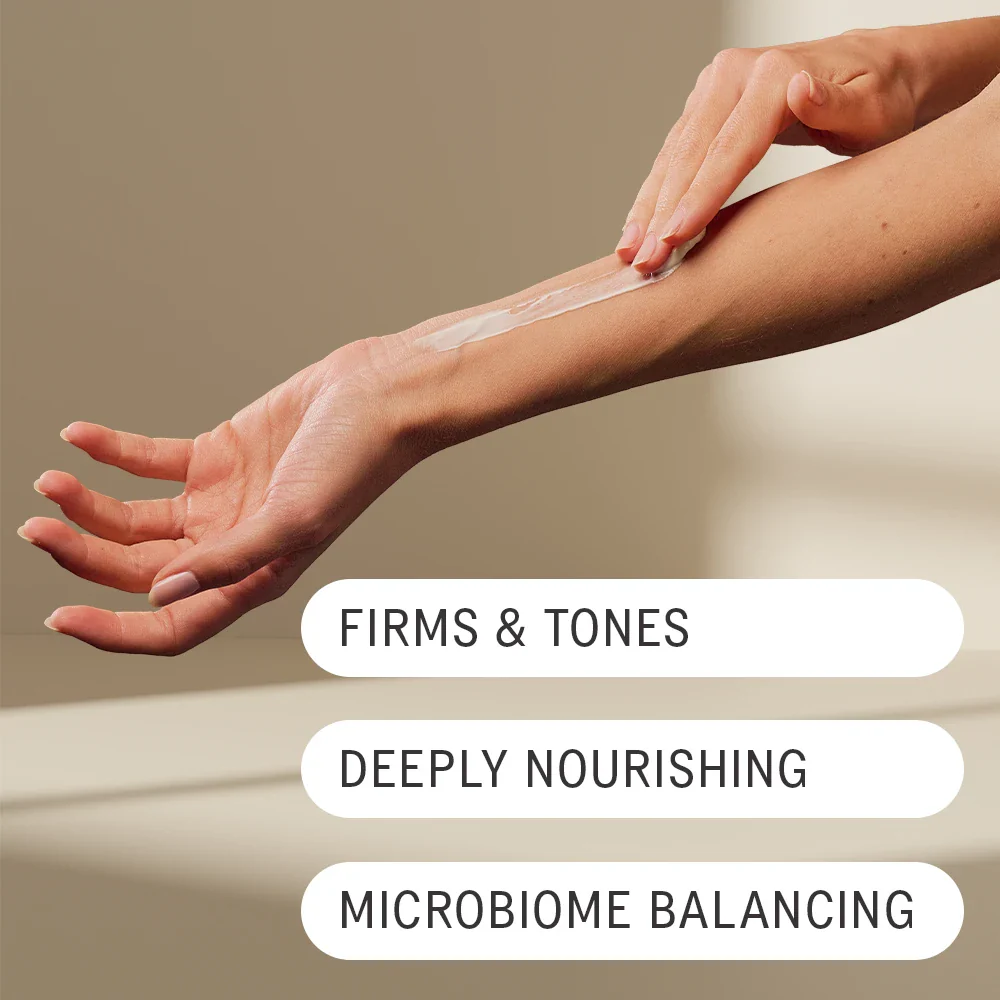 Person Rubbing AKT's Body Conditioning Balm onto their left arm with their right hand. Text overlaid the image reads: "Firms & Tones, Deeply Nourishing, Microbiome balancing."