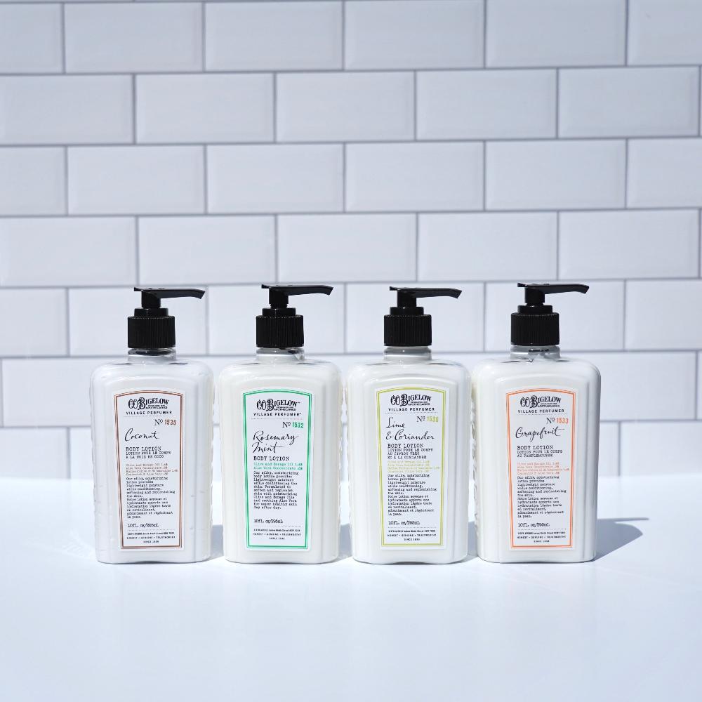CO Bigelow Village Perfumery Body Lotion Collection on a white surface in front of white tile background. 