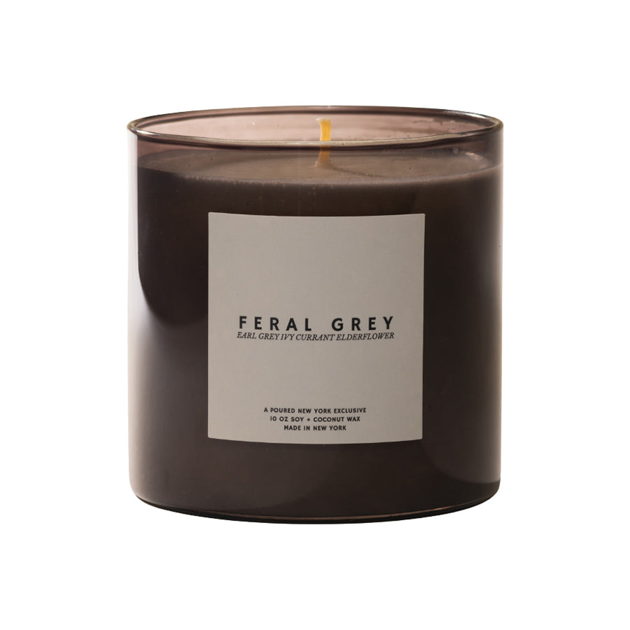 Feral Grey candle with a label on a white background