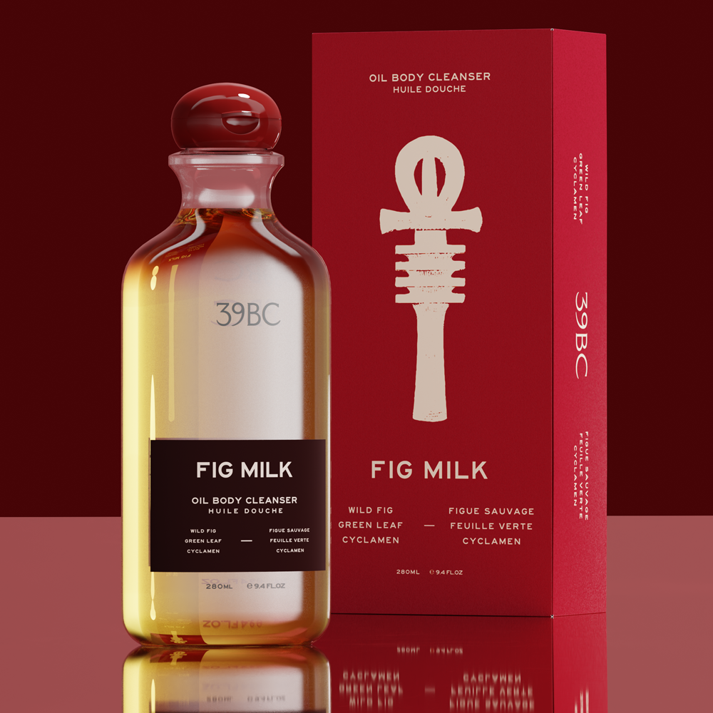 Bottle of 39BC Fig Milk Oil Body Cleanser  next to its red packaging box, set against a dark red background with a reflective surface.