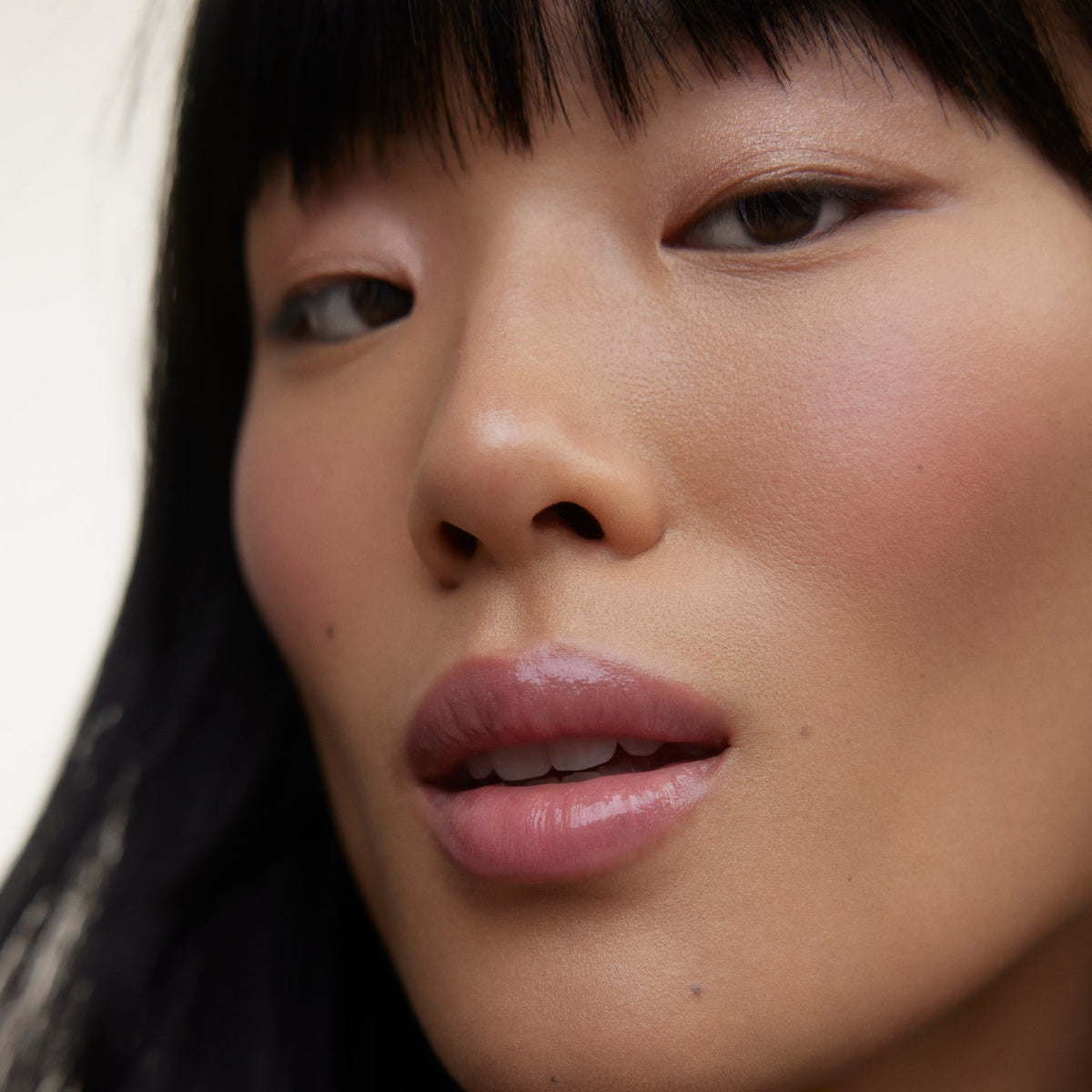 Closeup of woman's face wearing Wonderblush makeup.