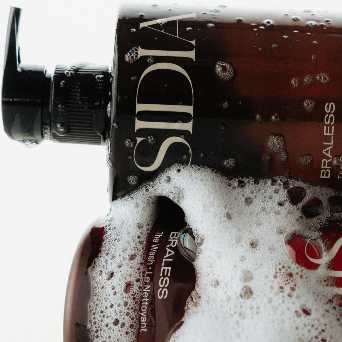 SIDIA "The Wash" bottles amid soap suds