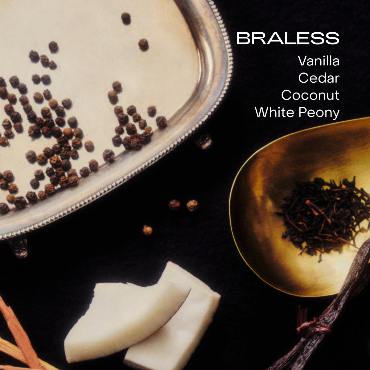 Vanilla, cedar, coconut, and white peony on a black background