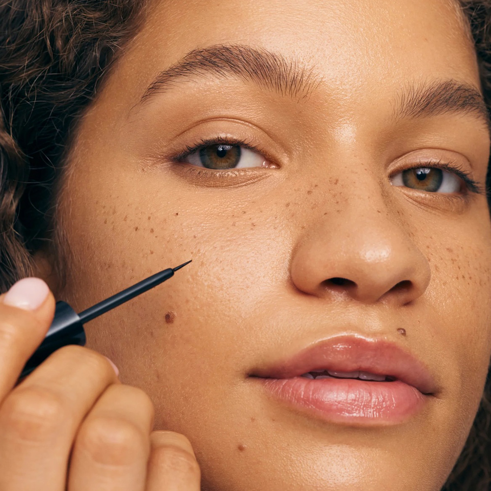 Person applying product to their face