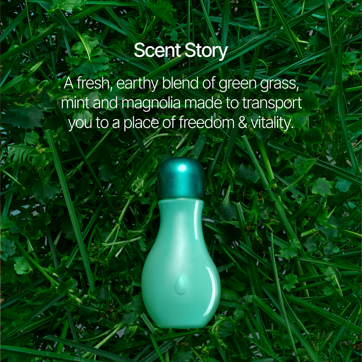 A mint green bottle with a metallic teal cap sits on a bed of green grass. White text above reads 'Scent Story' and describes a fresh earthy blend of green grass, mint, and magnolia.