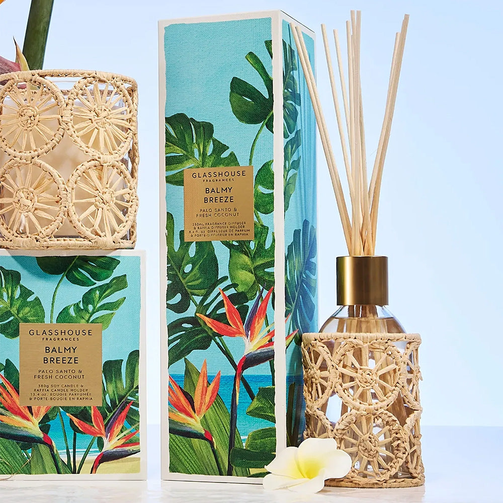 Glasshouse Balmy Breeze diffuser with decorative packaging featuring tropical leaves and flowers.