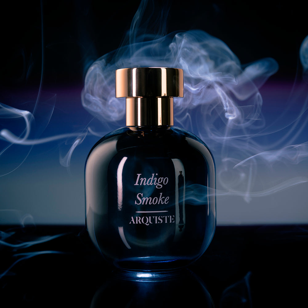 Perfume bottle in front of a multi-color smoky background