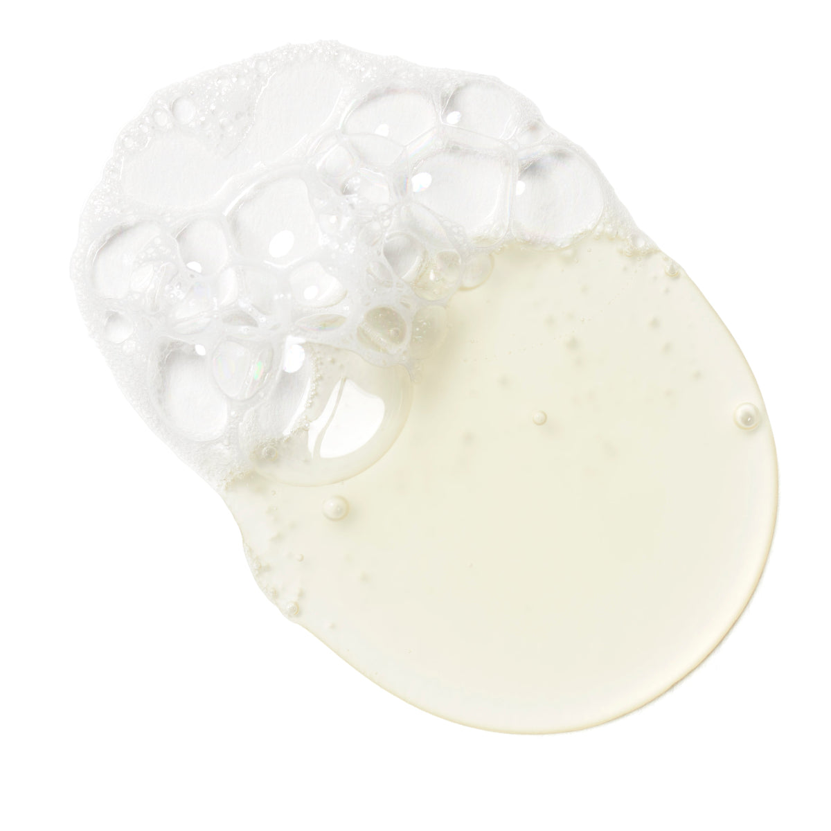 Clear silicone baby teether with a white liquid on a white background
