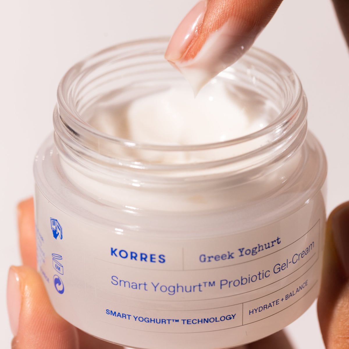Korres Greek Yoghurt Smart Yoghurt Probiotic Gel-Cream jar with cream being scooped out