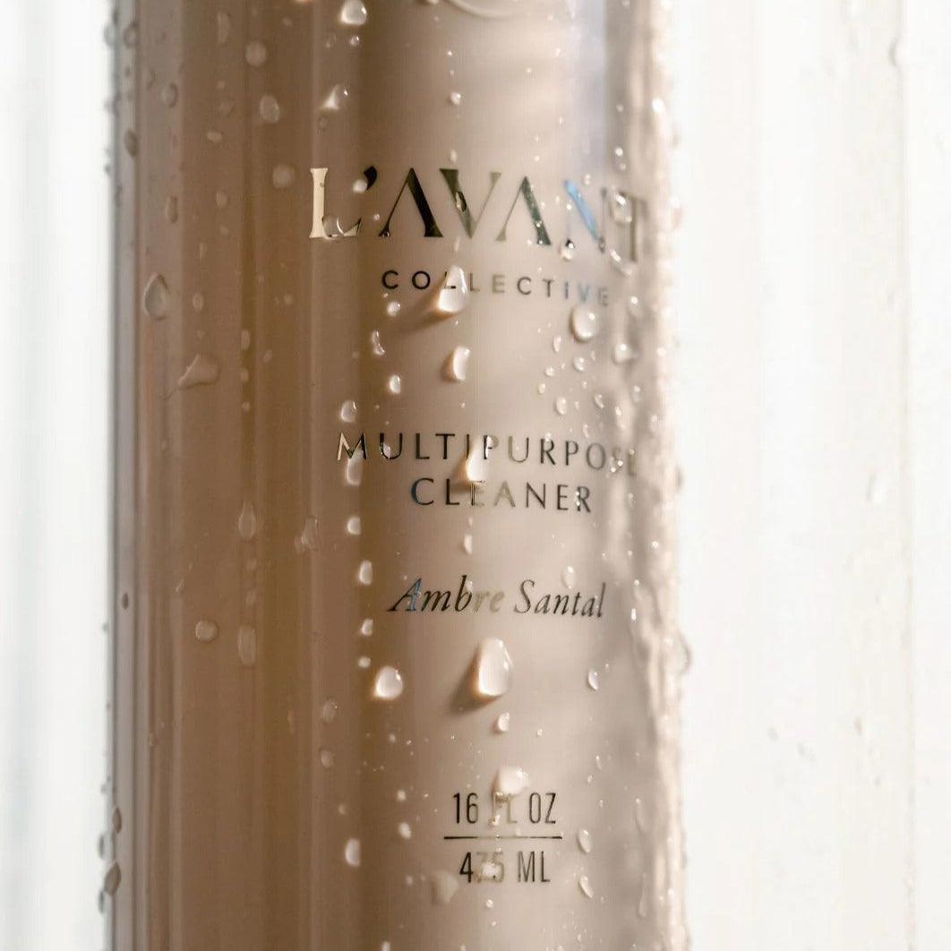 L'avant Collective multi-purpose cleaner bottle with droplets on a white background
