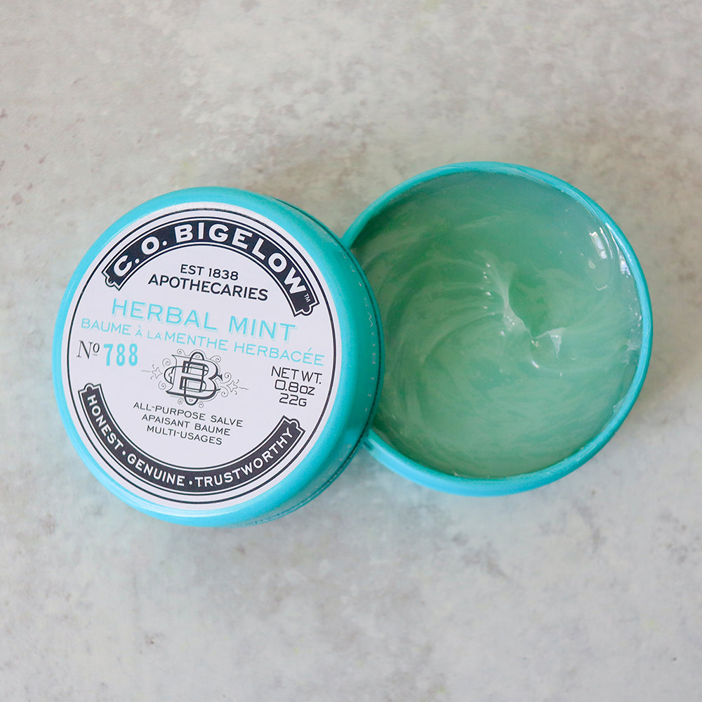 C.O. Bigelow Herbal Mint salve container on a light gray background