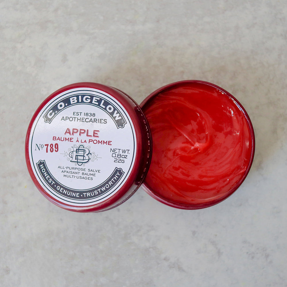 C.O. Bigelow Apple All-Purpose Salve Tin on a light gray background