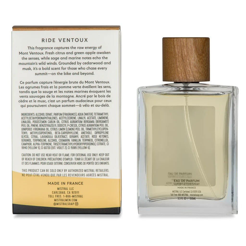Perfume bottle with wooden cap and packaging on a white background